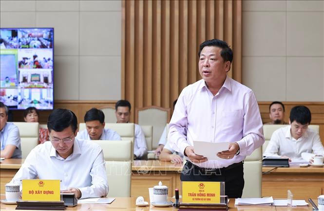 Bộ trưởng Bộ Xây dựng Trần Hồng Minh báo cáo kết quả và nhiệm vụ trọng tâm các dự án trọng điểm ngành giao thông vận tải. Ảnh: Dương Giang/TTXVN Bộ trưởng Bộ Xây dựng Trần Hồng Minh báo cáo kết quả và nhiệm vụ trọng tâm các dự án trọng điểm ngành giao thông vận tải. Ảnh: Dương Giang/TTXVN